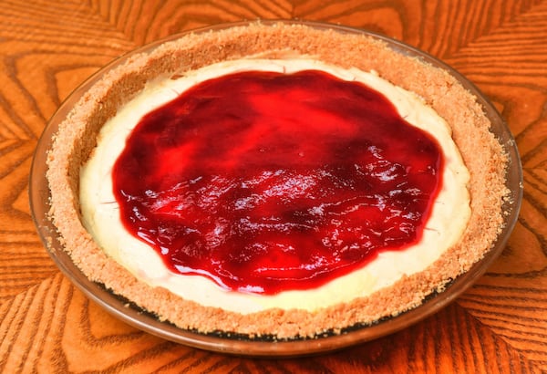 You’ll top your Jelly Doughnut Cream Pie with raspberry jam or preserves. Inside your pie will be nutmeg and vanilla flavors. STYLING BY PAUL ARGUIN AND CHRIS TAYLOR / CONTRIBUTED BY CHRIS HUNT PHOTOGRAPHY