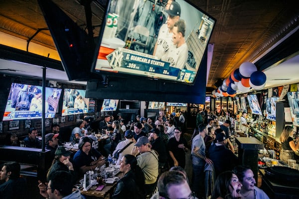 Patrons watch a Major League Baseball World Series game at Dalton Bar in Manhattan, Oct 25, 2024. A Senate committee discussed the potential for federal regulation of sports gambling during a nearly two-hour hearing on Tuesday, Dec. 17, 2024, that focused on how the industry’s widespread legalization across the United States was affecting athletes, the general public and the integrity of amateur and professional sports. (Jeenah Moon/New York Times)
                      