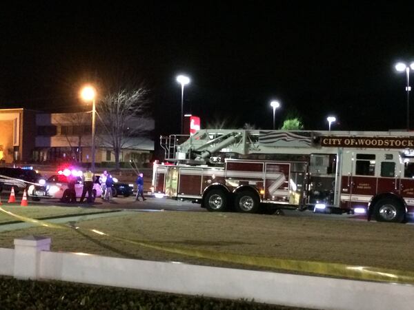 A person was shot and killed about 9:30 p.m. Tuesday on Highway 92 in Woodstock. Police have the suspect in custody. ELLEN ELDRIDGE / ELLENELDRIDGE@AJC.COM