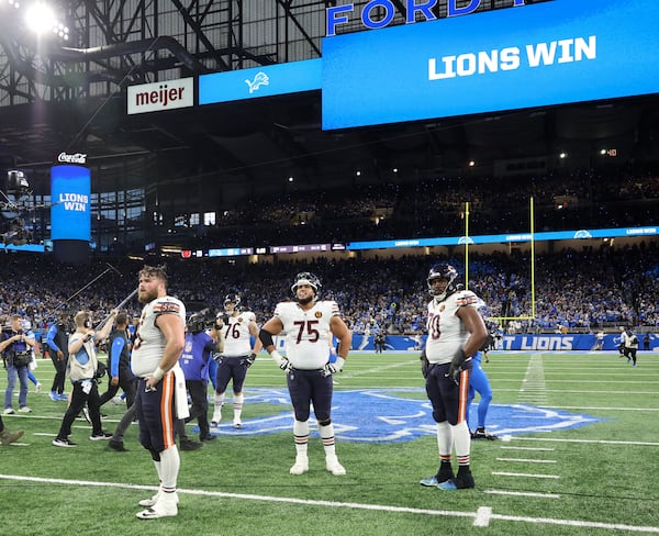 Chicago Bears offensive linemen stand on the field as they lose 23-20 to the Detroit Lions at Ford Field on Nov. 28, 2024, in Detroit, Michigan. (John J. Kim/Chicago Tribune/TNS)