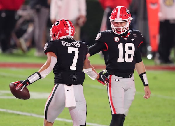 Georgia wide receiver Jermaine Burton (7) celebrates with quarterback JT Daniels (18) after scoring a TD near the end of the half against Mississippi State Saturday, Nov. 21, 2020, at Sanford Stadium in Athens.    (Curtis Compton / Curtis.Compton@ajc.com)  