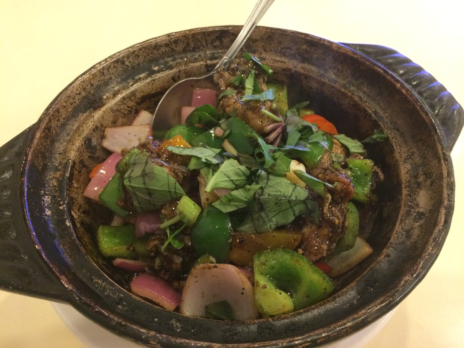 Oyster lovers will dig this clay-pot “casserole” with plump oysters, peppers, onions and fresh basil. CONTRIBUTED BY WENDELL BROCK