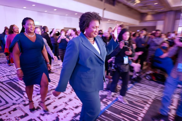 Stacey Abrams, the Democratic candidate for Governor of Georgia, waves to supporters as she walks toward the stage during the election night watch party at the Hyatt Regency in Atlanta on Tuesday, November 8, 2022. 
Miguel Martinez / miguel.martinezjimenez@ajc.com