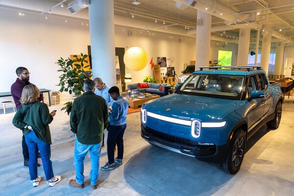 Rivian employees meet in the company's new showroom at Ponce City Market in Atlanta.