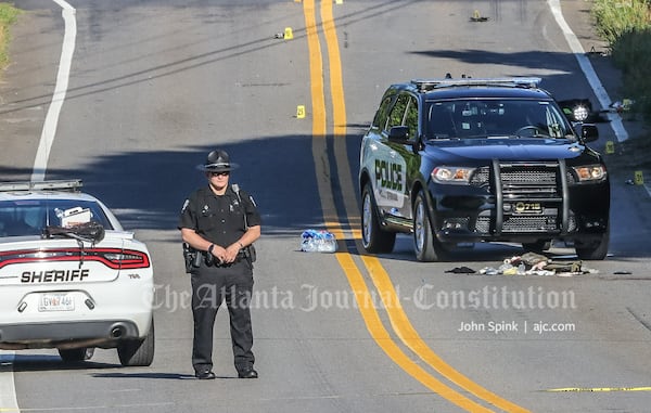 The officer's police SUV was stopped in the middle of Hickory Road, and a passenger vehicle was wrecked in a nearby ditch.