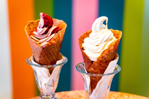 Two soft-serve waffle cones at Wonderkid: raspberry-chocolate swirl (left) and non-dairy pineapple (right). CONTRIBUTED BY HENRI HOLLIS