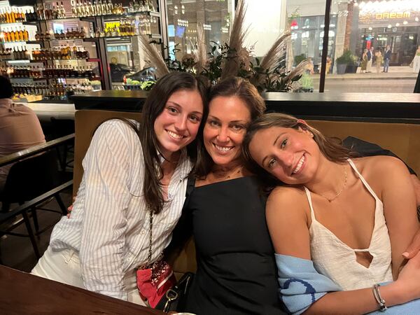 Allison Hill (center) and daughters Cristina Hill, 20, (left) and Chauncey Hill, 22. They, along with husband and father Geoff Hill, recently donated four kitchen renovations to families in need in Atlanta. Courtesy of Allison Hill 
