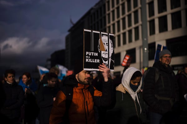 People attend a demonstration under the slogan "Stop Putin! Stop the War! Freedom for Political Prisoners!" in Berlin, Germany, Sunday, Nov. 17, 2024. (AP Photo/Markus Schreiber)