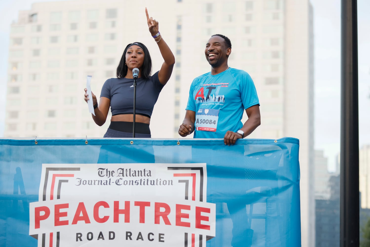 Maria Taylor and Atlanta Mayor Andre Dickens at the start of the 53rd running of the Atlanta Journal-Constitution Peachtree Road Race in Atlanta on Monday, July 4, 2022. (Miguel Martinez / Miguel.MartinezJimenez@ajc.com)