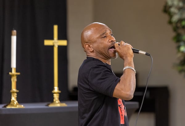 Kenneth Miller, a Fulton County high school athletic director, speaks at a rally for him at East Point First Mallalieu United Methodist Church on March 17, 2022. Miller is appealing a suspension after he was accused of pushing a student during a campus search for a handgun. He has been on paid leave from his post at Tri-Cities High School since shortly after the August incident.  (Jenni Girtman for The Atlanta Journal-Constitution)