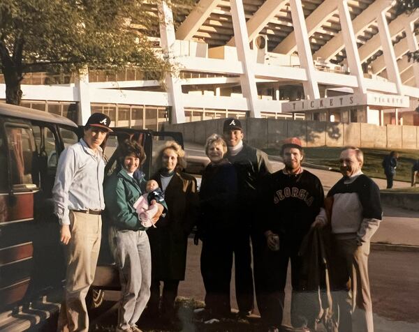 Braves fan Joe Sturniolo, a coach at Westminster Schools, has attended each Braves home opener since his first in 1975, making this year's opener, April 5, 2024, Sturniolo's 50th consecutive opener. Here he joins several friends who attended the 1989 opener with him. From left, Joe Sturniolo, Kay Sturniolo holding 9-week-old Katie Sturniolo, Jody Shipley, Sue Sturniolo, Walt Haber, Ed Thomas and Joe Sturniolo, the father. (Photo contributed by Joe Sturniolo)