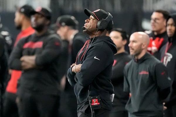 Atlanta Falcons head coach Raheem Morris watches during the first half of an NFL football game against the Carolina Panthers, Sunday, Jan. 5, 2025, in Atlanta. (AP Photo/Mike Stewart)