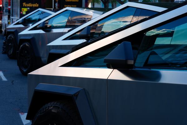 FILE - Tesla Cybertrucks are displayed at the AutoMobility LA Auto Show, Nov. 21, 2024, in Los Angeles. (AP Photo/Damian Dovarganes, File)