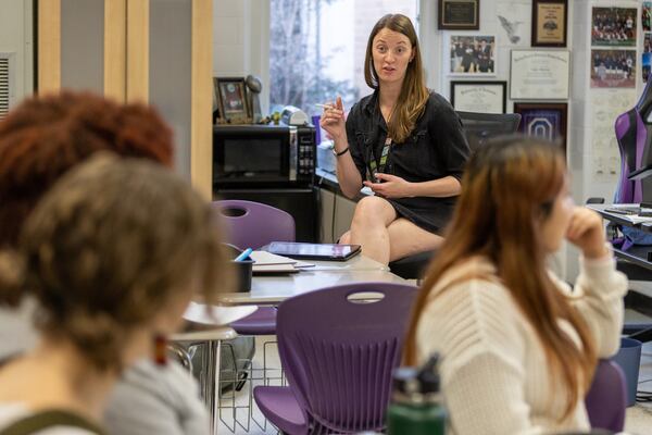 Lakeside High School math teacher Taylor Ohlstrom talks with students in her college algebra class on Tuesday, Jan. 31, 2022. (Steve Schaefer/steve.schaefer@ajc.com)