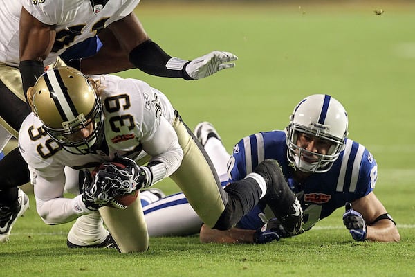 MIAMI GARDENS, FL - FEBRUARY 07: Chris Reis #39 of the New Orleans Saints fight for the ball against Hank Baskett #81 of the Indianapolis Colts after a onside kick to start the second half with during Super Bowl XLIV on February 7, 2010 at Sun Life Stadium in Miami Gardens, Florida. (Photo by Ronald Martinez/Getty Images)