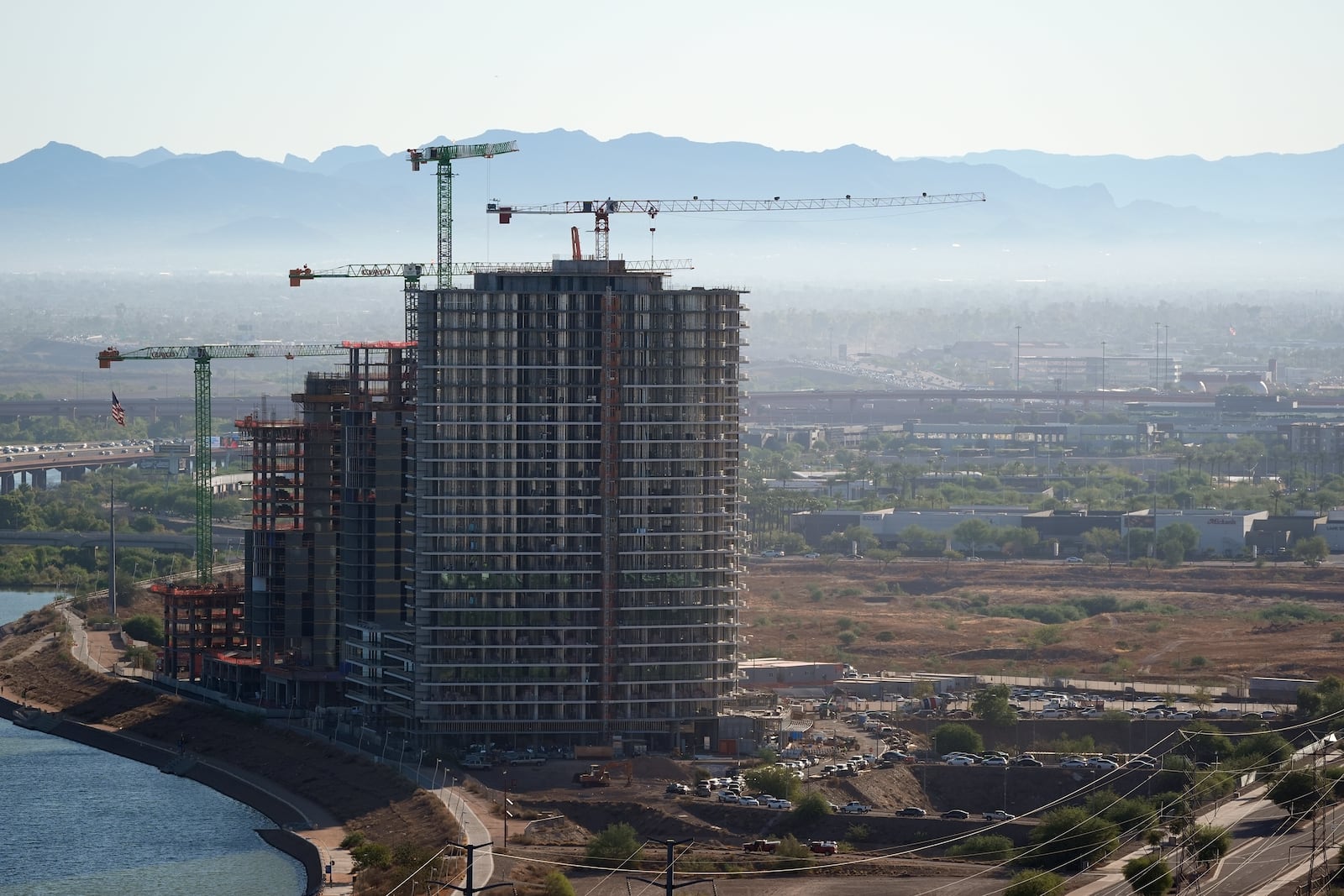 A large building is shown under construction near Tempe Town Lake Tuesday, Sept. 24, 2024, in Tempe, Ariz. (AP Photo/Ross D. Franklin)