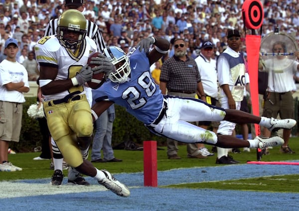 Georgia Tech' s Kelly Campbell pulls in a touchdown pass in front of North Carolina's Billy-Dee Greenwood during the first half Sept. 30, 2000 at Kenan Stadium in Chapel Hill, North Carolina. (Brant Sanderlin/AJC file photo)