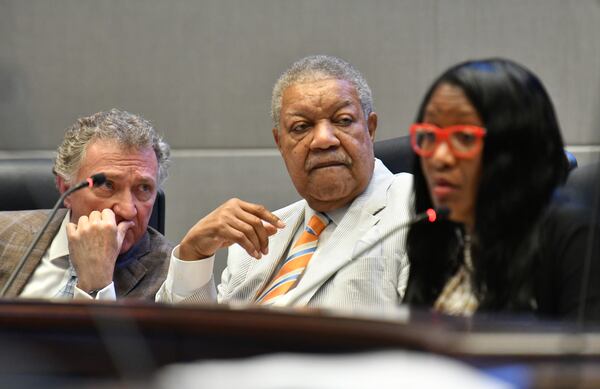 Commissioner Lee Morris (left) and Commission Chairman Robb Pitts confer during a meeting at the Fulton County government building in Atlanta on Wednesday, July 14, 2021. (Hyosub Shin / Hyosub.Shin@ajc.com)