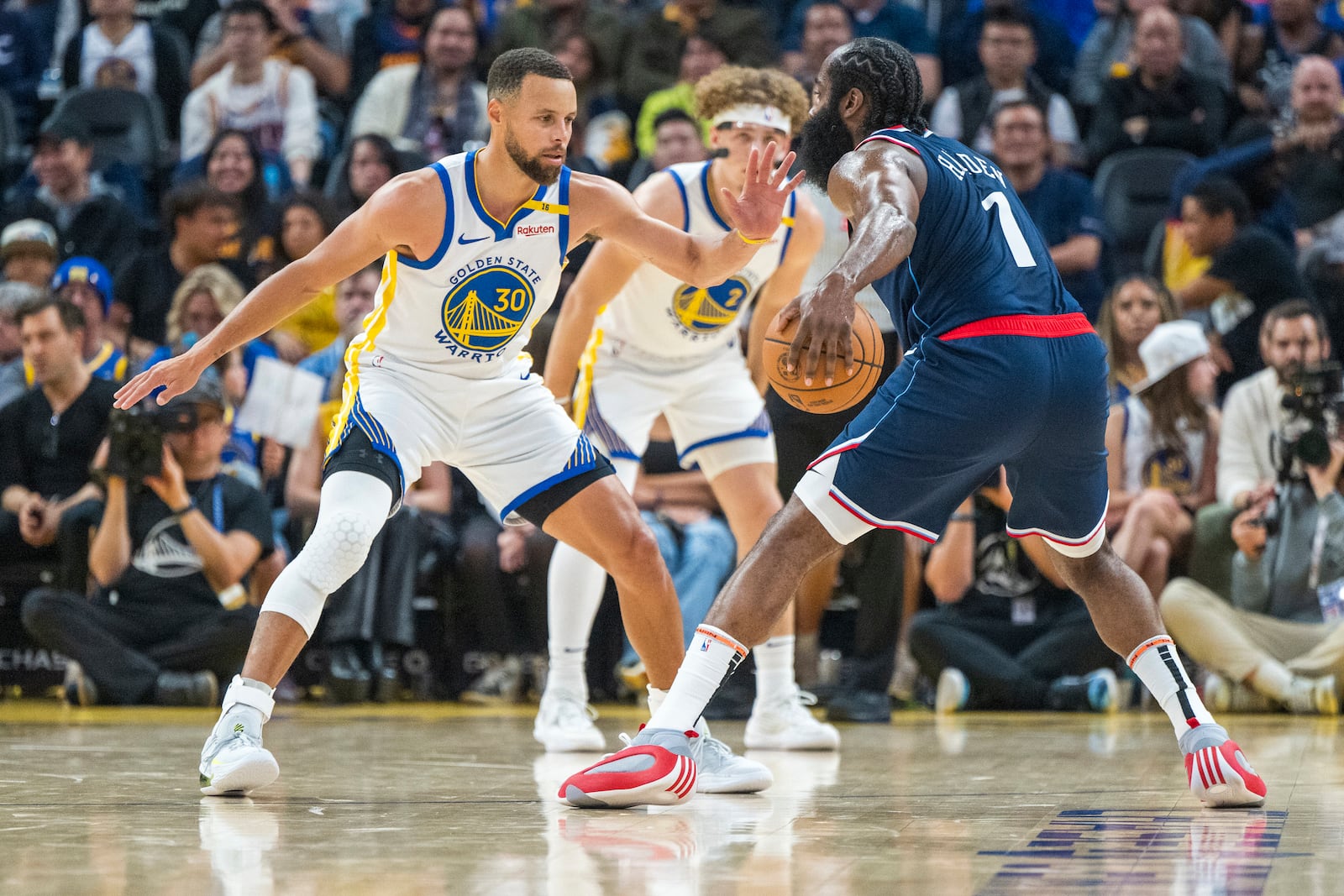 Golden State Warriors guard Stephen Curry (30) tries to block Los Angeles Clippers guard James Harden (1) during the first half of an NBA basketball game in San Francisco, Sunday, Oct. 27, 2024. (AP Photo/Nic Coury)