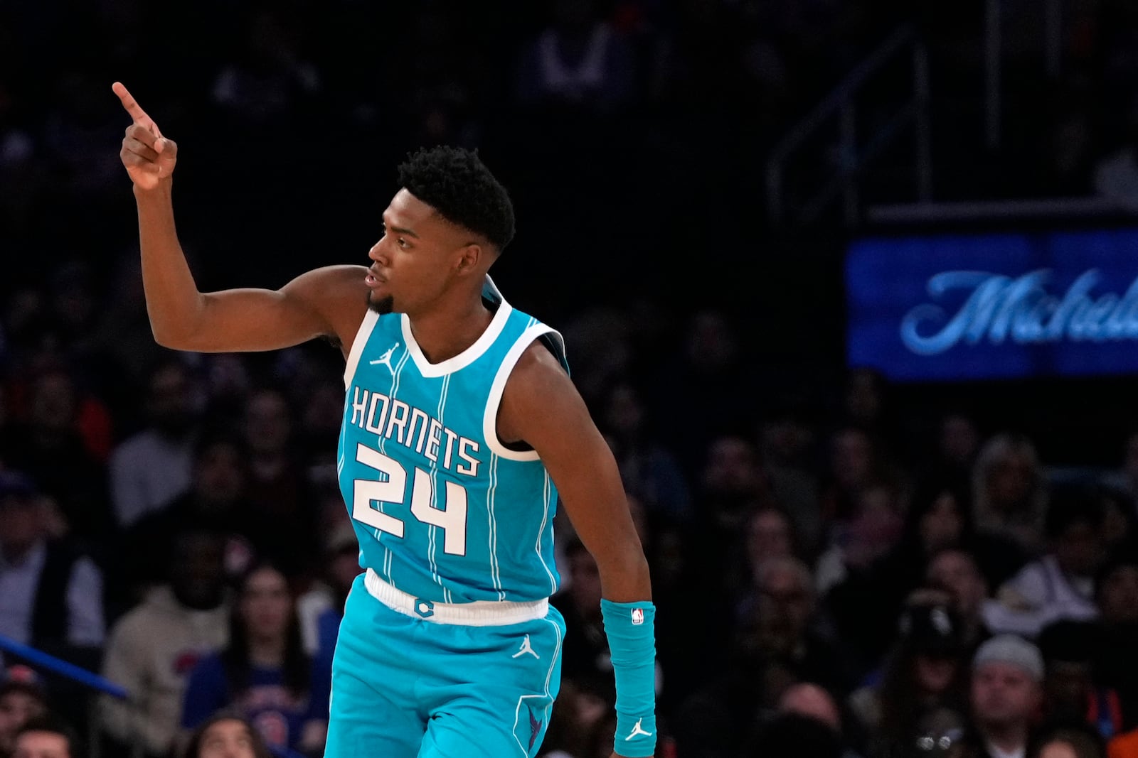 Charlotte Hornets' Brandon Miller reacts after scoring during the first half of a preseason NBA basketball game against the New York Knicks, Tuesday, Oct. 15, 2024, in New York. (AP Photo/Pamela Smith)