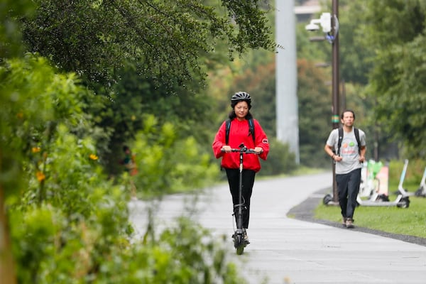 Mona Su, who lives in Midtown, was seen riding her scooter along the beltline on her way home on Monday, July 22, 2024. For Mona Su, riding scooters is a car-free lifestyle that provides an easy and reliable commuting alternative.
(Miguel Martinez / AJC)