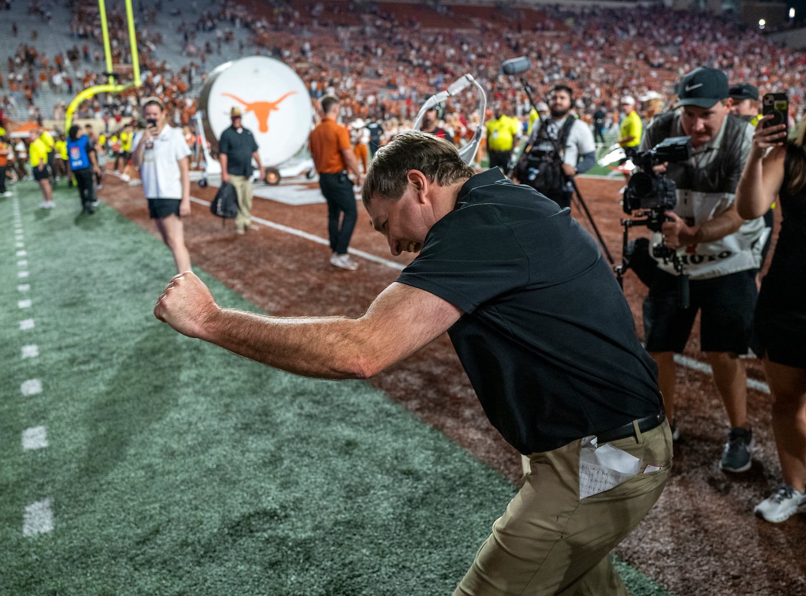 Georgia head coach Kirby Smart celebrates with Georgia fans cheering from the stands after defeating Texas during an NCAA college football game in Austin, Texas, Saturday, Oct. 19, 2024. (AP Photo/Rodolfo Gonzalez)