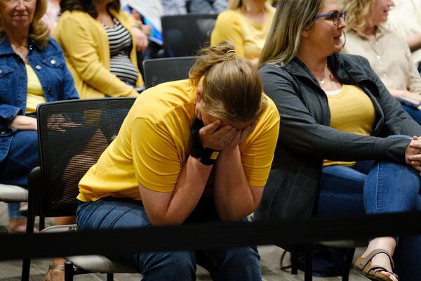 Brittany Bengert reacts to a speaker who advocates for removing certain books from Cherokee County schools.  Members of the public spoke both for and against removing books that some deem objectionable at a Cherokee County school board meeting in Canton on Thursday, April 21, 2022. (Arvin Temkar / arvin.temkar@ajc.com)