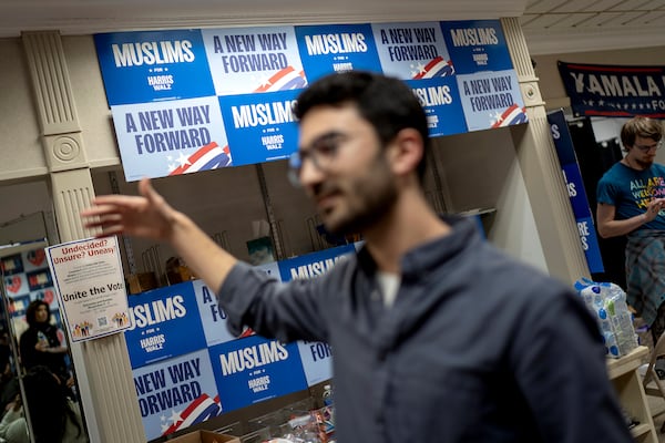 Signs decorate a campaign office for Democratic presidential nominee Vice President Kamala Harris, Sunday, Nov. 3, 2024, in Dearborn, Mich., the nation's largest Arab-majority city. (AP Photo/David Goldman)