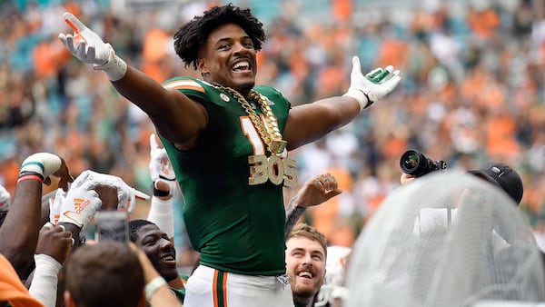 University of Miami defensive end Gregory Rousseau wears the turnover chain during a 2019 game against Central Michigan. (Michael Laughlin/Sun Sentinel/TNS)