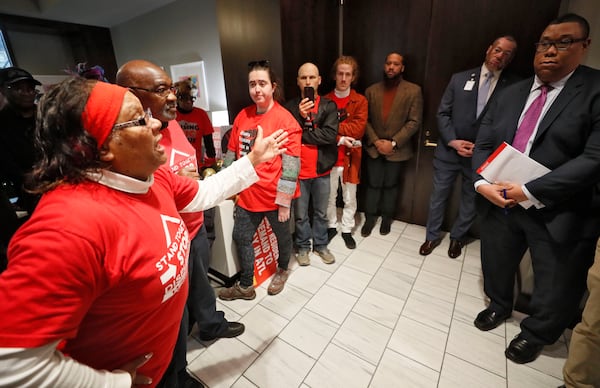 Bertha Darden, who joined other Peoplestown residents in a legal battle to try to keep their homes, talks with a senior advisor to Mayor Keisha Lance Bottoms at City Hall during a sit-in at the mayor's office on December 16, 2019. The protesters want Atlanta Mayor Keisha Lance Bottoms to let Peoplestown residents in the city stay in their homes and not be displaced by eminent domain to build a park and retention pond. (Bob Andres / bandres@ajc.com)