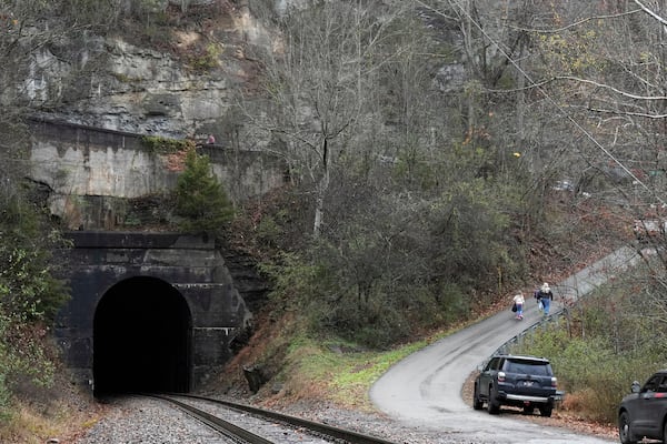 People leave after a visit of the CSX Santa Train, Saturday, Nov. 23, 2024, in Haysi, Va. The train brings presents to small towns along a 110-mile portion of the railroad line in rural Appalachian Tennessee, Kentucky and Virginia. (AP Photo/George Walker IV)