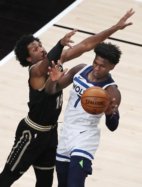 Hawks forward Solomon Hill guards against Minnesota Timberwolves guard Anthony Edwards during the MLK Day Unity game Monday, Jan. 18, 2021, at State Farm Arena in Atlanta. The NBA's top draft, a former Georgia Bulldog, was making his professional debut in his hometown. (Curtis Compton / Curtis.Compton@ajc.com)