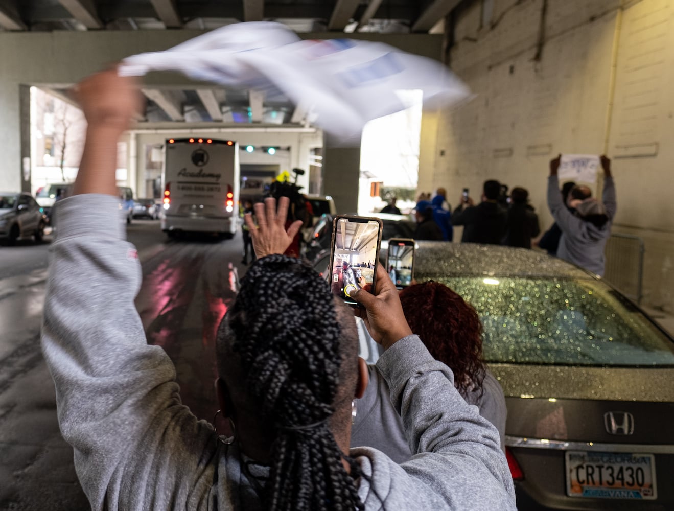 220308-Atlanta-Tina Clyce, whose son Jamall plays for Georgia State, cheers as the team bus pulls in Tuesday, March 8, 2022, after the team won the Sun Belt Conference championship. Ben Gray for The Atlanta Journal-Constitution