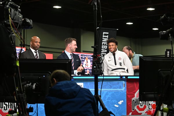 Ohio State safety Caleb Downs, who is from Hoschton, reacts as he gets prepared for a TV interview during Media Day at the Georgia World Congress Center ahead of the 2025 College Football National Championship between Notre Dame and Ohio State, Saturday, January 18, 2025, in Atlanta. (Hyosub Shin / AJC)