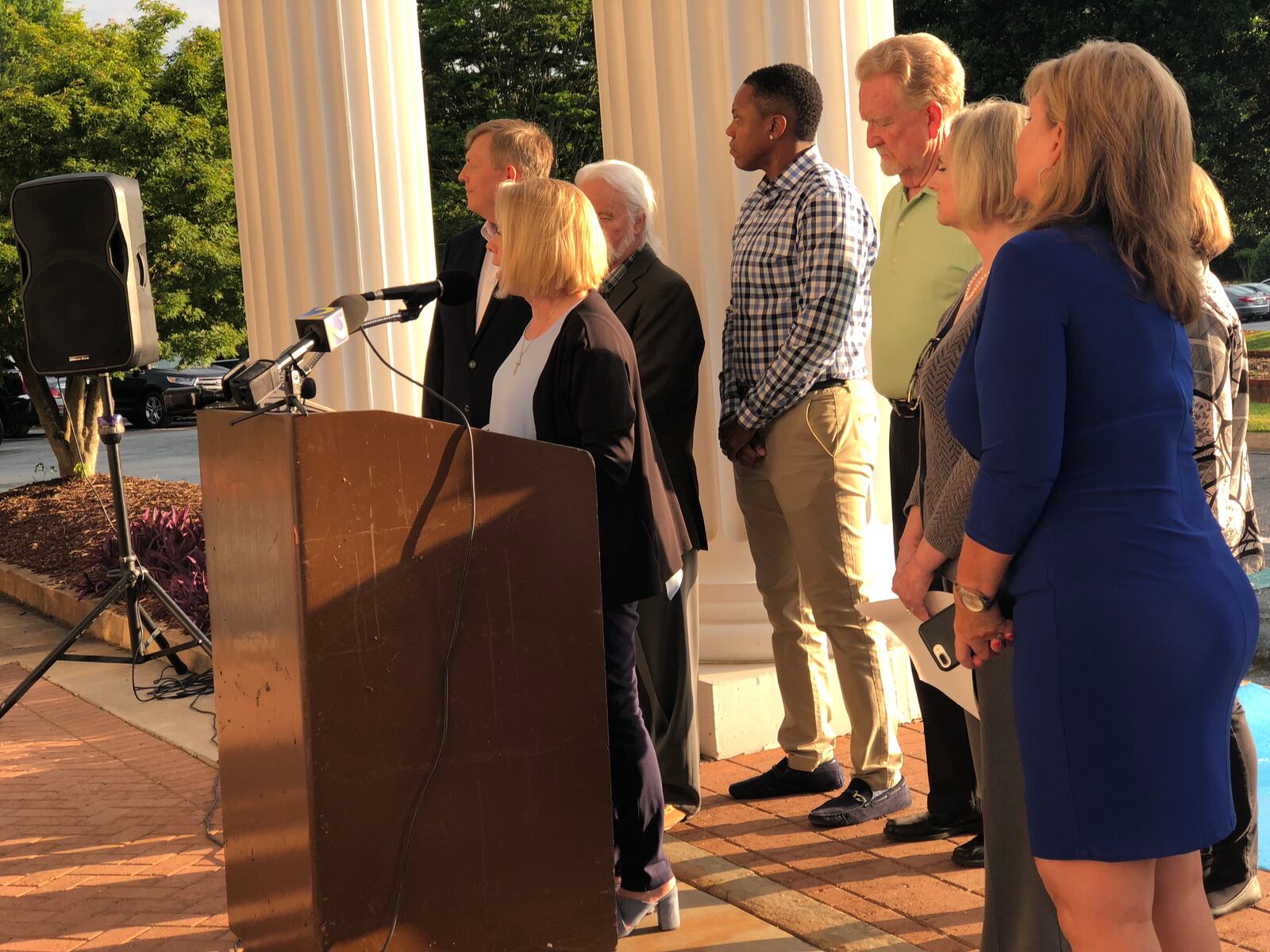 Stockbridge leaders held a community meeting Wednesday to explain their opposition to Eagle’s Landing cityhood at Eagle’s Landing Country Club. Months earlier cityhood supporter Vikki Consiglio (at microphone) held a press conference outside the facility after the legislature allowed Eagle’s Landing residents to create their own town. LEON STAFFORD/AJC.