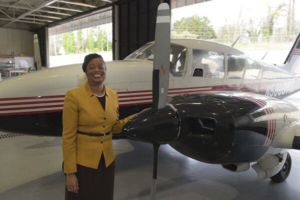 Dr. Murray Williams, vice president of academic affairs, stands by a training aircraft Atlanta Tech has for its aviation maintenance program. Kent D. Johnson/AJC