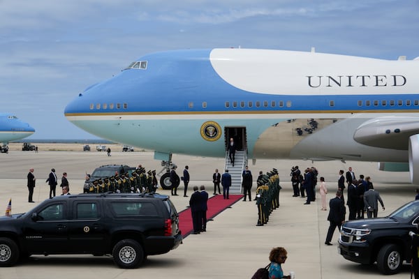 President Joe Biden disembarks Air Force One after arriving at Catumbela airport in Angola on Wednesday, Dec. 4, 2024. (AP Photo/Ben Curtis)