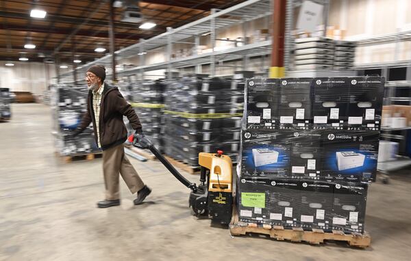 Truckloads of voting machines arrived Tuesday at Fulton County’s Election Preparation Center in Atlanta. An Atlanta Journal-Constitution polls found that 85% of respondents expressed some degree of confidence that Georgia’s new voting machines will accurately record election results. (Hyosub Shin / Hyosub.Shin@ajc.com)