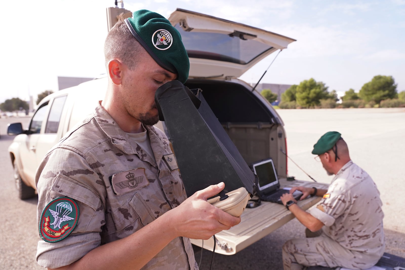 A soldier from the Spanish Parachute Squadron (EZAPAC) operates a drone in the search for bodies after floods in Barranco del Poyo on the outskirts of Valencia, Spain, Tuesday, Nov. 5, 2024. (AP Photo/Alberto Saiz)