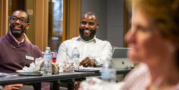 DeMario Pressley (center) attends his second board meeting at the YMCA in Cumming. The former NFL player volunteered there throughout his career and has now joined the board of the Forsyth County Family YMCA. The Y is where he was introduced to sports in middle school, and it's the place where he sought refuge from a dangerous neighborhood. PHIL SKINNER FOR THE ATLANTA JOURNAL-CONSTITUTION.