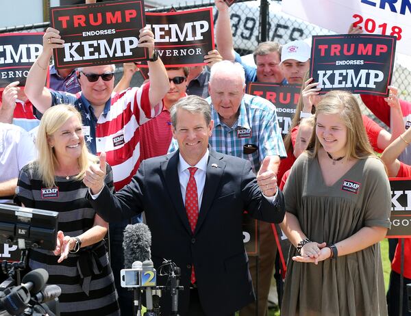 Secretary of State Brian Kemp, with his wife Marty and daughter Lucy, gives the double thumbs up making his first campaign stop on Monday at PDK airport in Atlanta. Curtis Compton,ccompton@ajc.com