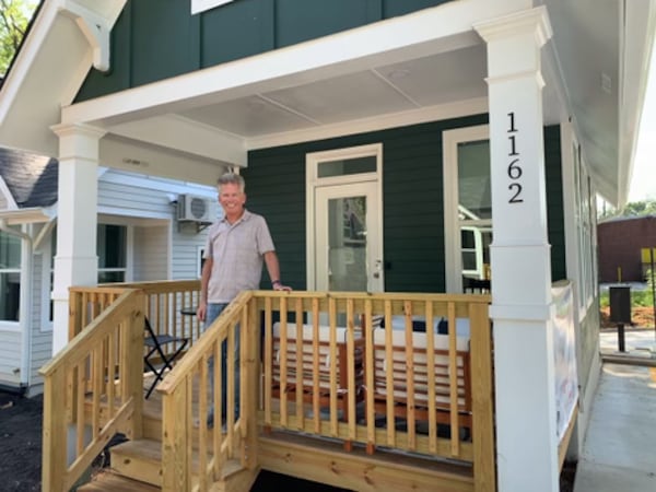 Rich Pasenow standing on the front porch of his home on July 22.