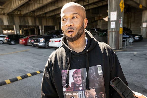 Cleveland Jackson talks to the media at the Richard B. Russell Federal Building after Hill's prison sentence hearing Tuesday, Mar. 14, 2023. (Steve Schaefer/steve.schaefer@ajc.com)