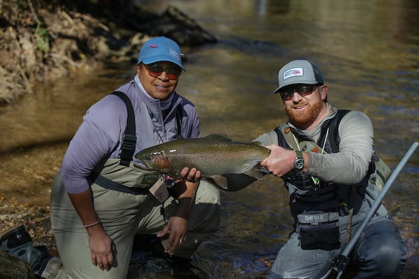 Casting for Recovery retreat attendee Stephanie Jackson with passionate angler and guide Jake Darling from Winged Reel at a recent retreat. Photo by Justin Dobson. 
Courtesy of Casting for Recovery