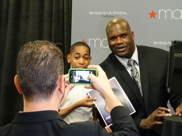 Shaq posed with fans at Lenox Square Macy's on Saturday, March 15, 2014, to promote his new menswear line. CREDIT: Rodney Ho/rho@ajc.com