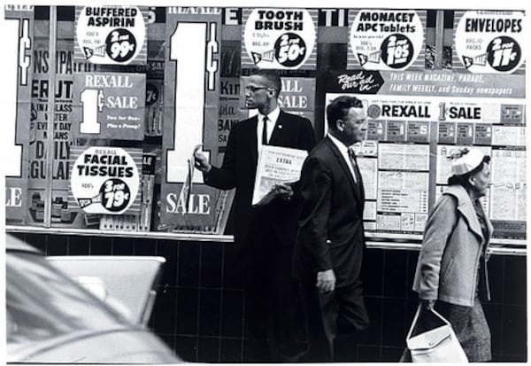 In this 1963 photograph taken in New York by Gordon Parks — which hangs in the National Portrait Gallery — Malcolm X sells a special issue of Muhammad Speaks, the Nation of Islam's official newspaper, that graphically illustrated an episode of police brutality in Los Angeles. Courtesy of National Portrait Gallery.