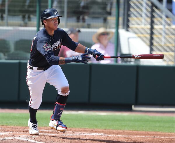 Braves' Ehire Adrianza hits a standup RBI-double against the Minnesota Twins to take a 3-0 lead during the third inning Tuesday, March 2, 2021, at CoolToday Park in North Port, Fla. (Curtis Compton / Curtis.Compton@ajc.com)