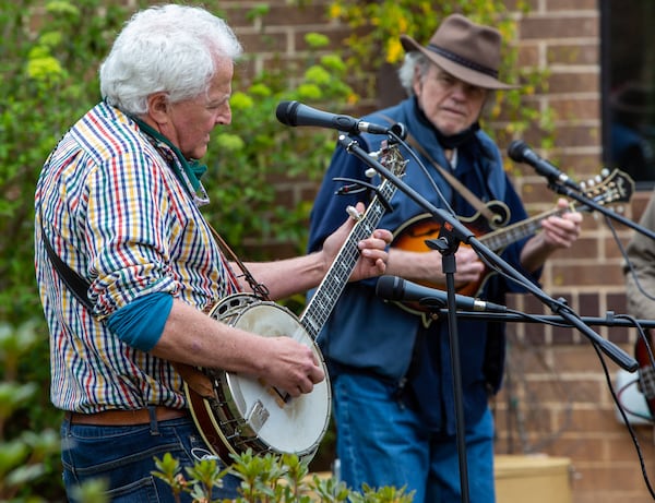 The Druid Hills Billys band members Paul Parker (left) and Jim Culliton perform at Clairmont Place in Decatur. The band, made up of physicians in the area, which regularly played at Clairmont Place before the pandemic, kept it up and increased performances during the lockdown. They played outdoors with residents listening from their balconies. PHIL SKINNER FOR THE ATLANTA JOURNAL-CONSTITUTION.