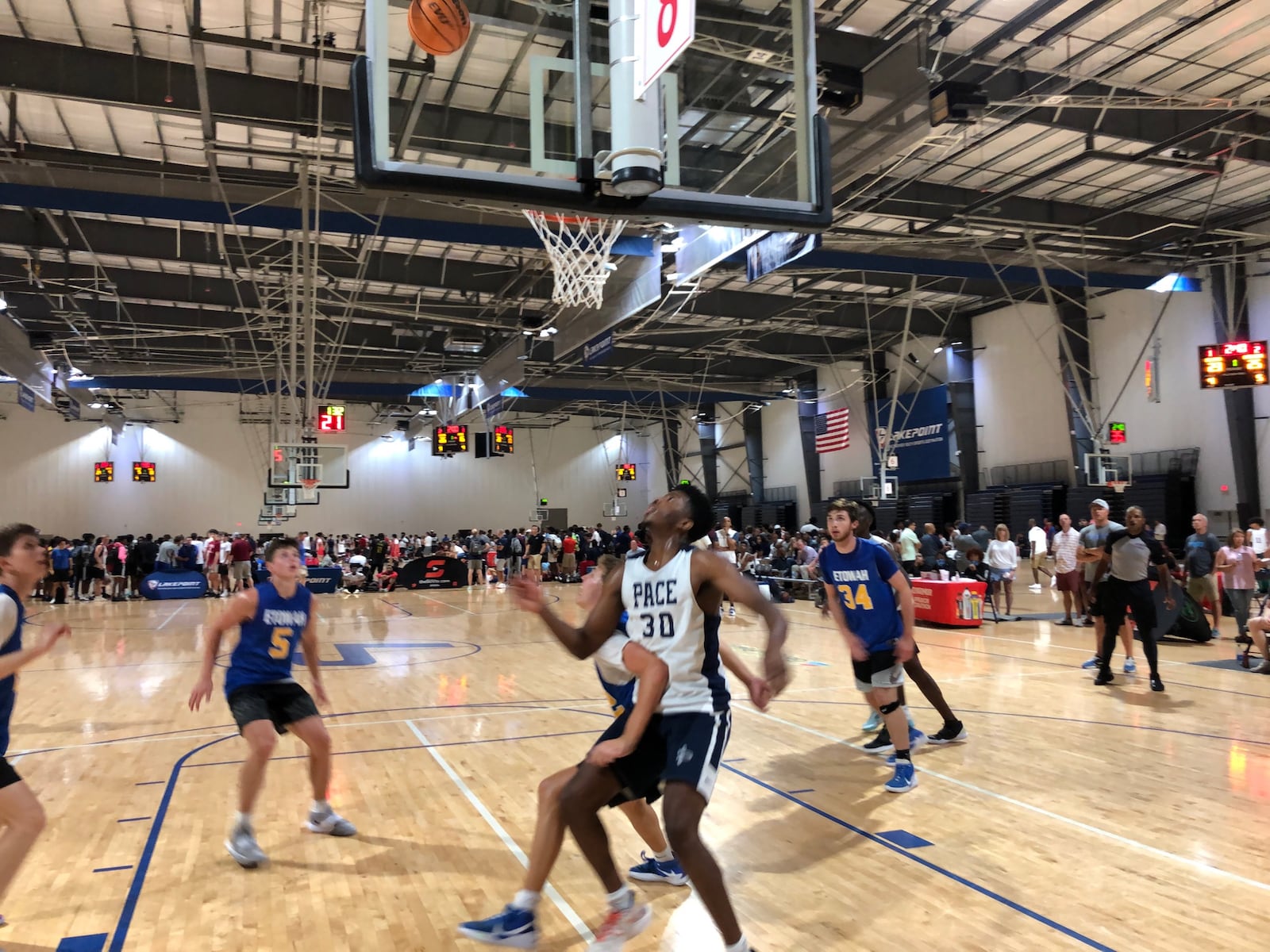 Pace Academy forward Josh Reed (white jersey) positions himself for a rebound in a game at the Georgia Basketball Coaches Association team camp at the LakePoint Sports complex in Emerson on June 18, 2021. (AJC photo by Ken Sugiura)