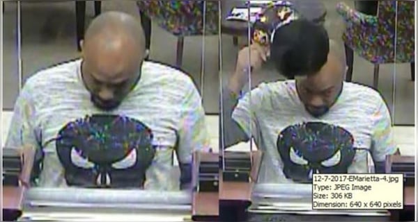 A man wearing a "Punisher" T-shirt robbed this Cobb County bank on Dec. 7,  the FBI said. (Credit: FBI)